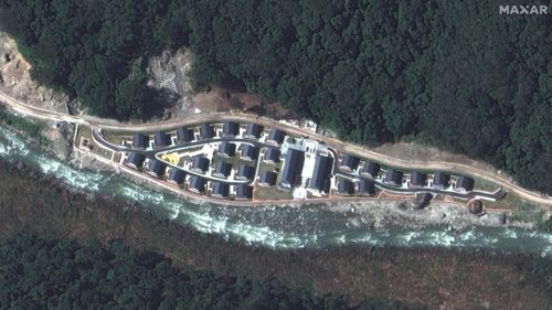Satellite imagery of the Chinese village of Pangda, provided by Maxar Technologies. The firm claims the village was built on the Bhutanese side of a disputed border with China.