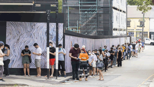 Dozens of people lining up to get a COVID-19 test in Redfern, Sydney.