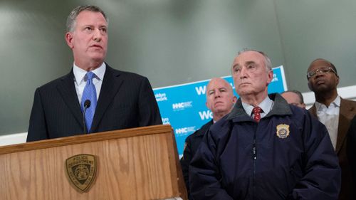  New York City Mayor Bill de Blasio, left, speaks alongside NYPD Commissioner Bill Bratton. (AAP)