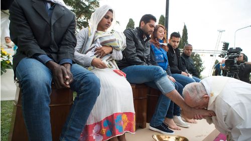 The pope washed the feet of 11 people at the Castelnuovo di Porto. (AAP)