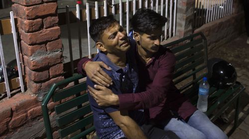 A father grieves the death of his son after the school bus plunged off a mountain road in India.