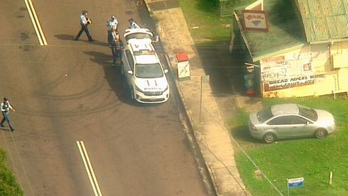 Police outside the General Store on Warners Avenue, where the stabbing occurred.