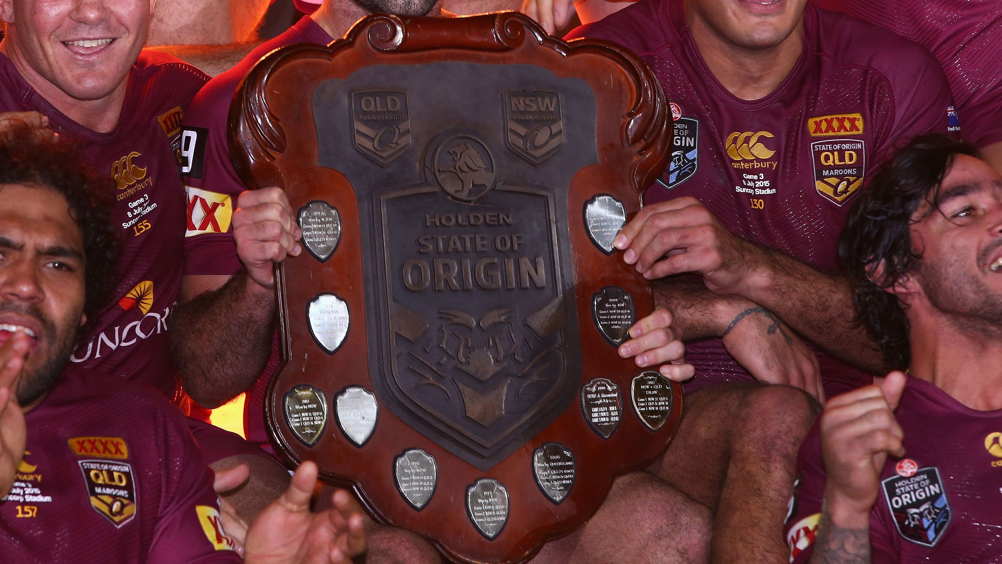Queensland celebrates with the Origin shield after a series win.