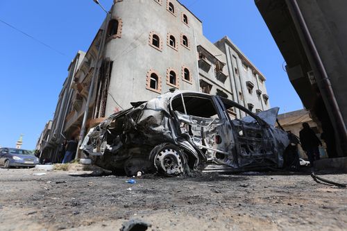 Wreckage of a vehicle is seen after East Libya-based forces led by commander Khalifa Haftar carried out rocket attacks at the Abu Salim neighborhood in Tripoli, Libya (Photo by Hazem Turkia/Anadolu Agency/Getty Images)