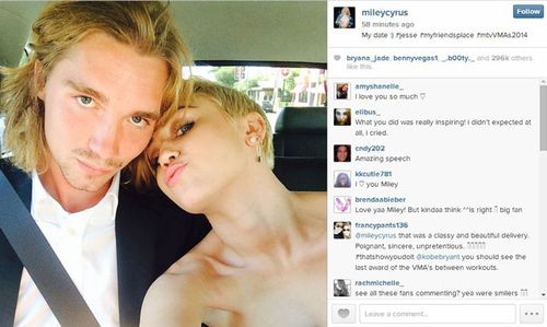 Miley Cyrus poses with her date to the MTV Video Music Awards. (Instagram)