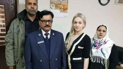 Tereza Hluskova, pictured smiling with customs officials at Lahore Airport.