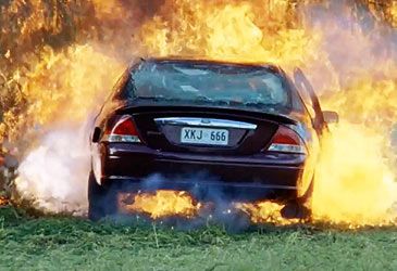 Which character faked their death in a car explosion before going into witness protection?