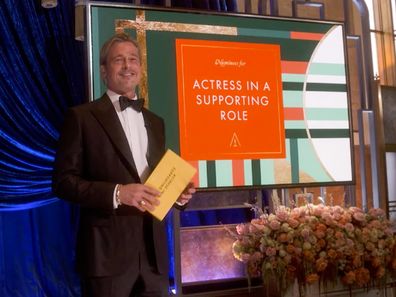 Brad Pitt presents at the 2021 Oscars