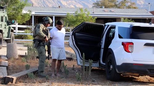 Jake Haro is seen being arrested on Friday in Cabazon, California.