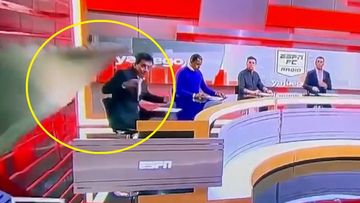 ESPN journalist crushed by falling set piece during live broadcast