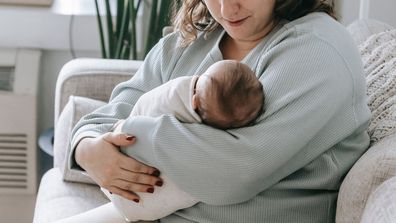 A woman with her baby. Stock image.