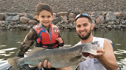 Tristan Evans, 4, and father Colin with their trophy-sized catch. (Colorado Outdoors Mag)