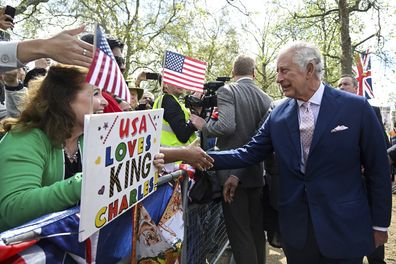 King Charles III greets well-wishers outside Buckingham Palace, in London, Friday, May 5, 2023 a day before his coronation takes place at Westminster Abbey