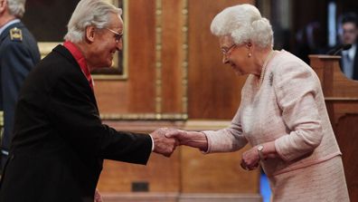 File photo dated 15/4/2104 of entertainer Nicholas Parsons is made a Commander of the Order of the British Empire (CBE) by Queen Elizabeth II during an Investiture ceremony at Windsor Castle, Berkshire