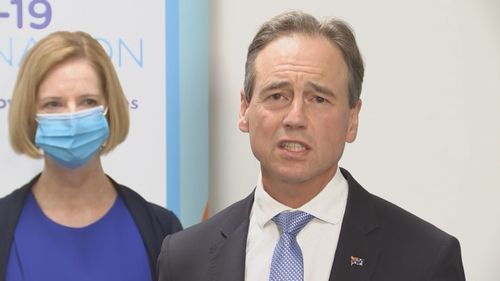 Health Minister Greg Hunt and former Prime Minister Julia Gillard.