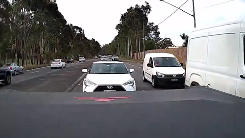 The driver of a ute has posted dash cam footage of a white van's prang on a Sydney road after an apparent dispute over who was in the wrong.