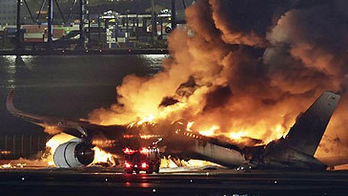 Japan Airlines flight 516 ablaze on airport tarmac (AP)
