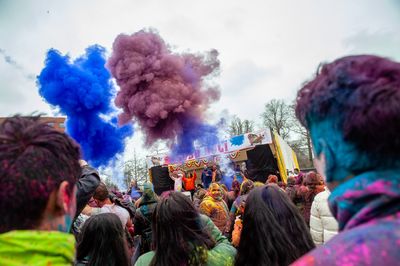 Giant cannons are used to  throw coloured powders during the celebration of Holi Festival.