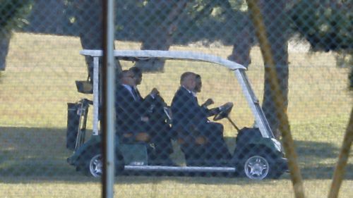 Mr Trump and Mr Abe golfing in Japan. (AAP)