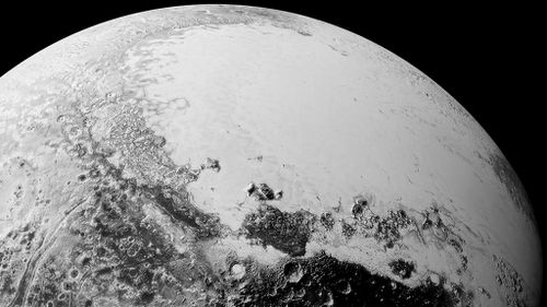 New Pluto photos reveal soaring mountains, dunes and frozen ice floes