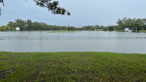 A sporting field resembles a lake after flooding in the Gold Coast.