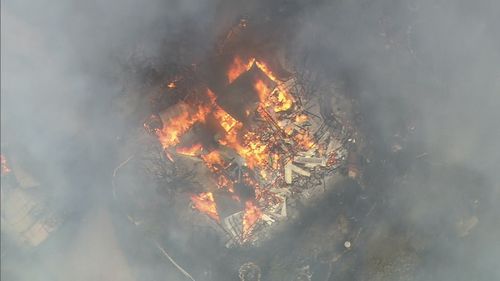 Buildings are being lost to a bushfire burning out of control in Western Australia's north-east.