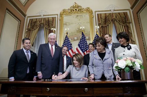 Speaker of the house Nancy Pelosi took part in a signing ceremony to temporarily reopen the government after a 21 day shutdown.