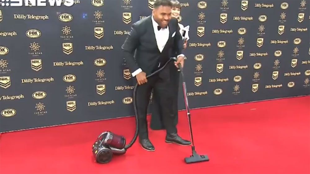 Brisbane Broncos forward Sam Thaiday arrives at NRL Dally M awards red carpet with a vacuum cleaner