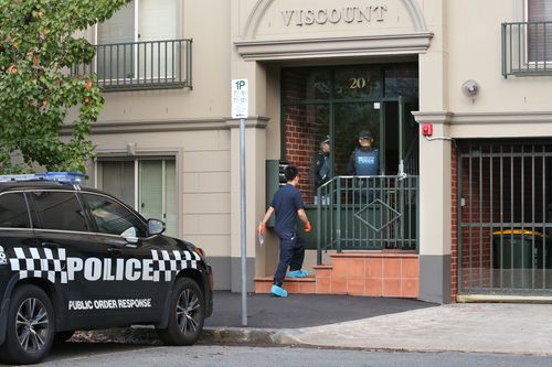 Officers remain on guard at a Bedford Street address after two people were arrested in a counter terrorism operation by Victoria Police.