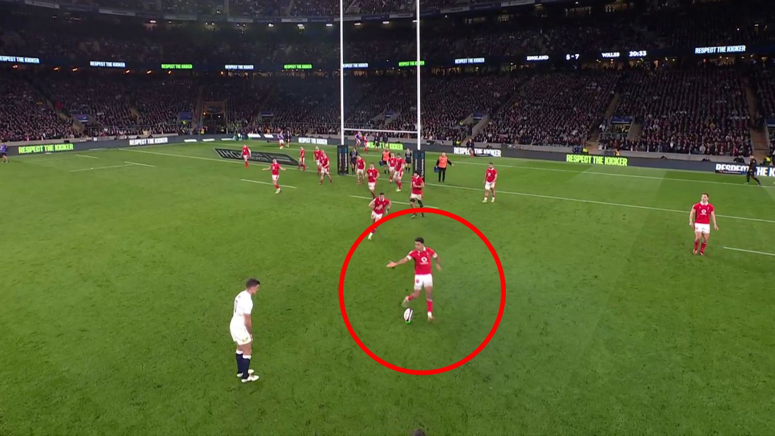 Rio Dyer and Elliot Dee rush at George Ford&#x27;s kicking tee after the England fly-half stepped, allowing the Welsh players an chance to knock the ball over.