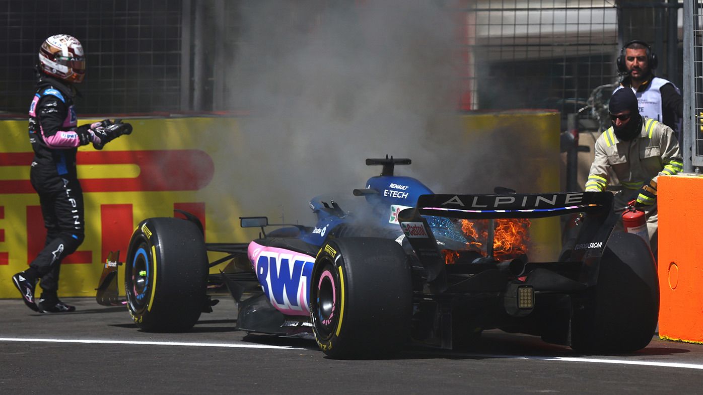 Pierre Gasly of France and Alpine F1 looks on as the fire in his car is put out during practice ahead of the F1 Grand Prix of Azerbaijan at Baku City Circuit on April 28, 2023 in Baku, Azerbaijan. (Photo by Francois Nel/Getty Images)