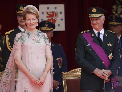 Belgium's Queen Mathilde, left, and Belgium's King Philippe, right, watch the National Day parade from the Royal tribune in Brussels, Wednesday, July 21, 2021. Belgium celebrates its National Day on Wednesday in a scaled down version due to coronavirus, COVID-19 measures. (AP Photo/Olivier Matthys)