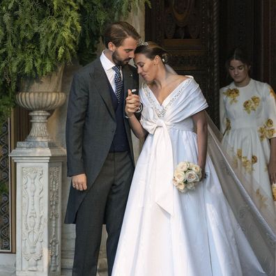 Prince Philippos, son of former King of Greece Constantine II, and his wife Nina Flohr leave the Athens Orthodox Cathedral following their wedding ceremony in Athens, Greece, October 23 (AP Photo/Yorgos Karahalis)