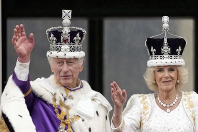 King Charles III and Queen Camilla wave from on the Buckingham Palace balcony during the Coronation of King Charles III and Queen Camilla on May 06, 2023 in London