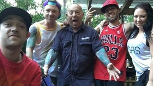Angry Anderson, centre, with son Liam, left.