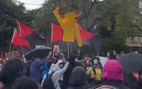 Flag burns at Melbournbe, Victoria protest