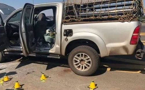 The couple's car marked with police cones.