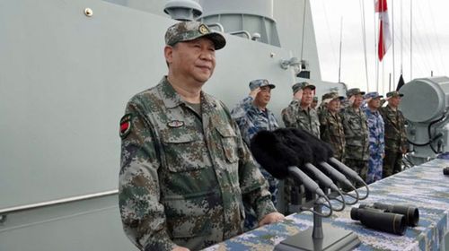 Chinese President Xi Jinping inspects a naval parade in the disputed sea. (AP).