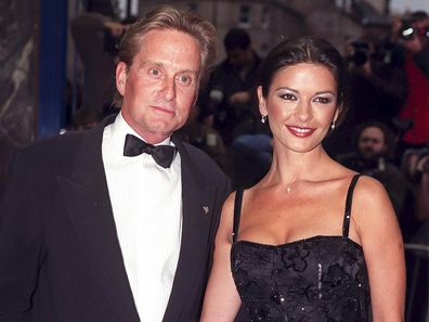 Catherine Zeta Jones, and Michael Douglas  attend The Premiere of, Entrapment, in Edinburgh,, on June 30, 1999  in, Edinburgh, Scotland.