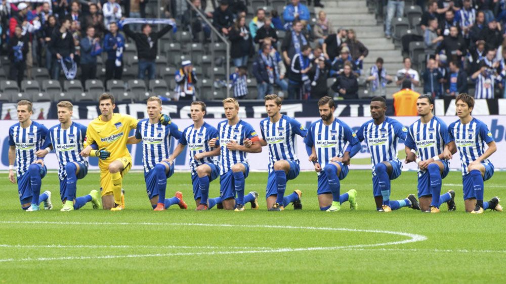 Socceroo Mathew Leckie takes a knee with Hertha Berlin to join athlete protests against discrimination