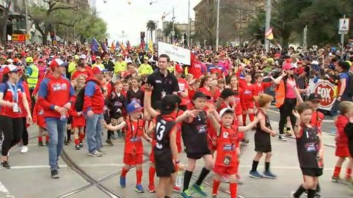 Thousands have taken to the streets of Melbourne today ahead of the final, marching to the MCG. 