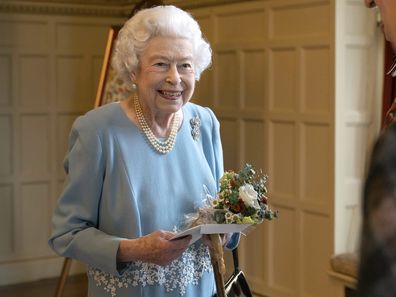 Queen Elizabeth talks to members of the West Norfolk Befriending Society, during a reception in the Ballroom of Sandringham House