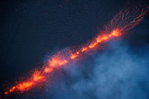 One of almost 20 fissures that have opened up, spewing lava and ash and threatening homes and properties. (EPA) 