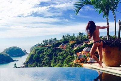 Lea Michele welcomed 2015 by sharing a topless Instagram photo.<br><br>The 28-year-old <i>Glee</i> actress, who is currently vacationing in Mexico with her boyfriend Matthew Paetz, shared the sexy poolside pic, captioned: "Let's do this 2015."