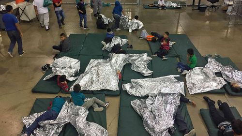 An undated handout photo made available on 18 June 2018 by the US Customs and Border Patrol showing people inside a United States Border Patrol Processing Center, in McAllen, Texas, USA.