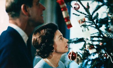 Queen Elizabeth and Prince Philip sign Christmas cards for royal staff  