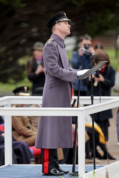 Prince William, Prince of Wales speaks at a lectern during a visit to the 1st Battalion Welsh Guards at Combermere Barracks for the St Davids Day Parade on March 01, 2023 in Windsor, England.