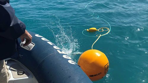 Shark control equipment being deployed at Sawmill Bay after two shark attacks in the Whitsundays.