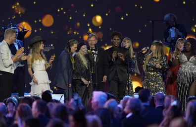 Joni Mitchell, fourth from left, and artists perform "Big Yellow Taxi" at the conclusion of the 31st annual MusiCares Person of the Year benefit gala honoring Mitchell on Friday, April 1, 2022, at the MGM Grand Conference Center in Las Vegas.