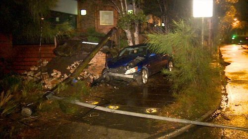 Police are searching for the driver of a Lexus that crashed into a light pole in Sydney's north and fled the scene.